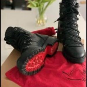 Christian Louboutin, red bottom boots.